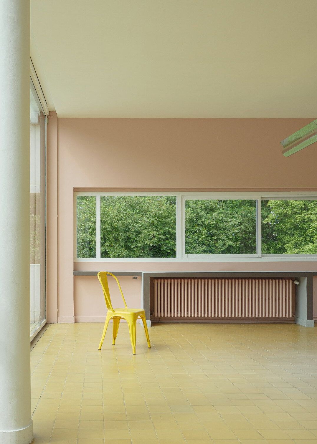 Modern open-plan office with desks and large windows