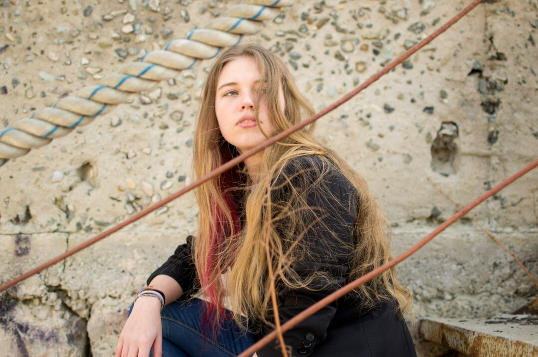 Portrait of a young woman with long hair smiling